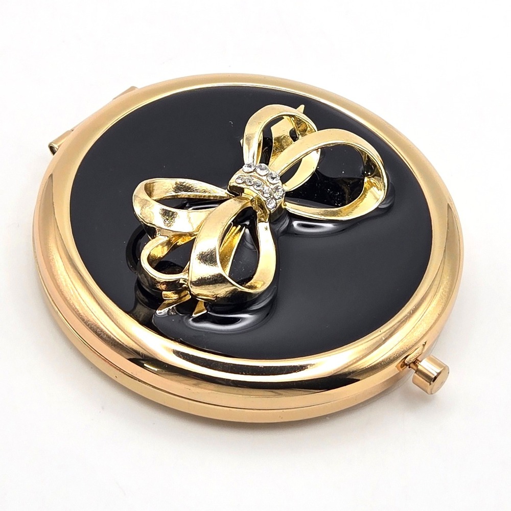 Avon Gold Tone Black Enamel Rhinestone Bow Compact Mirror Dual Sided Magnifying